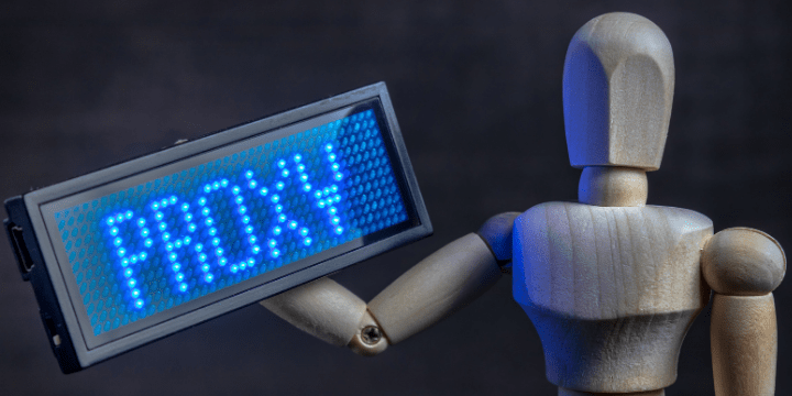 Proxy, a robot is holding PROXY sign